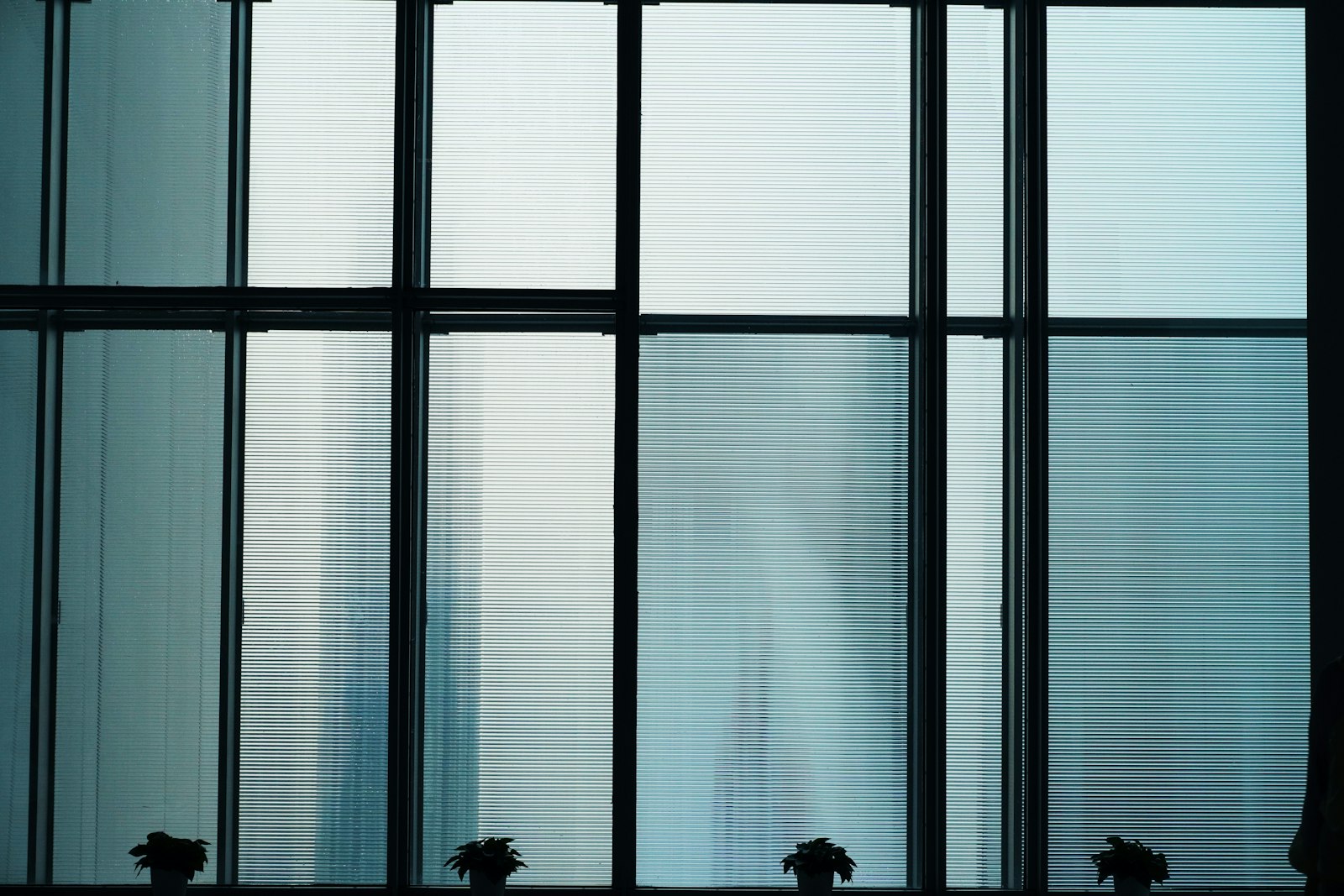 Figures behind a frosted glass wall